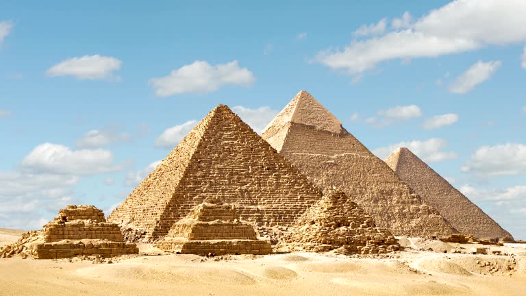 The Great Pyramids of Giza under a clear blue sky in Egypt